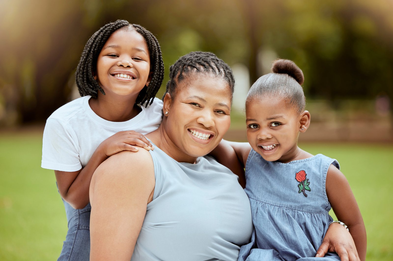 black-woman-children-nature-park-family-together-with-smile-hug-bonding-outdoor-portrait-mother-garden-girl-siblings-with-happiness-love-care-feeling-positive-summer